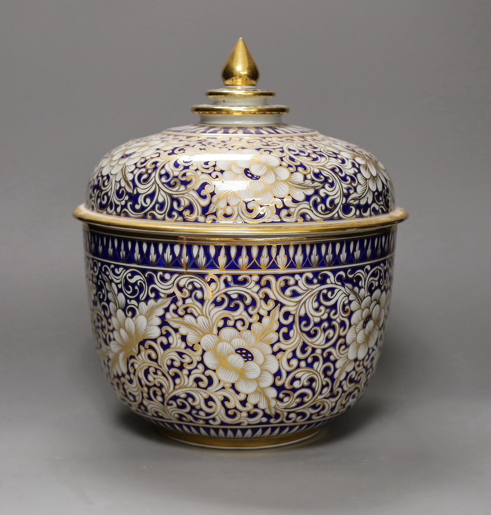 An ornate Continental porcelain bowl and cover, 29cm